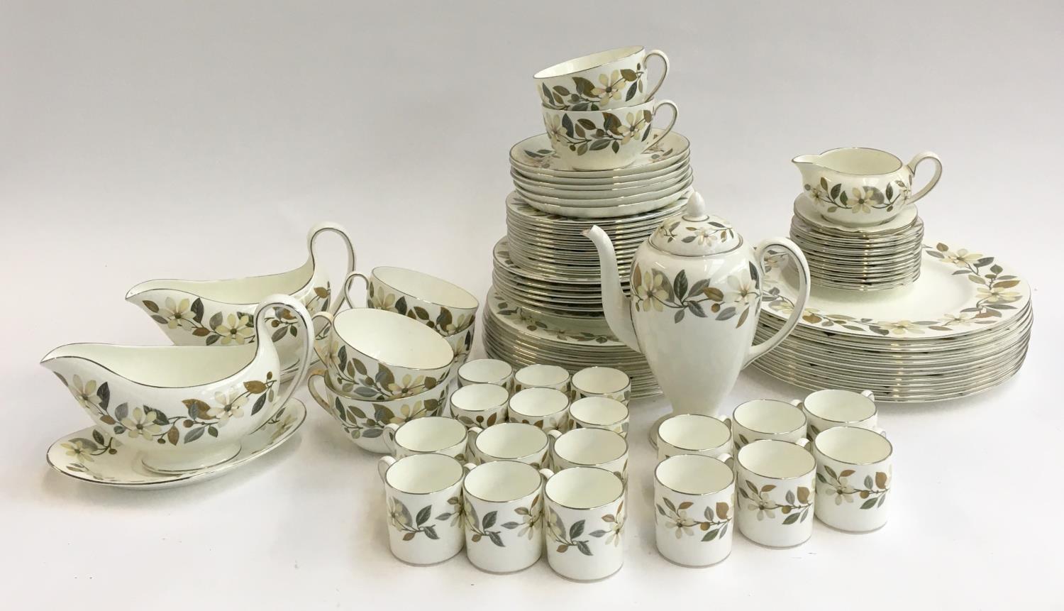 A Wedgwood Beaconsfield dinner service comprising dinner plates, side plates, coffee cans, coffee