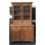 A Victorian pine dresser comprising glazed doors over two drawers above cupboard base, 123cmW,