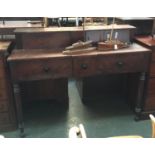 A large Victorian mahogany sideboard, having superstructure with two cupboard doors over three