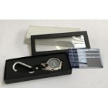 A Davis Micro Light clip watch, in silver, with presentation box and guarantee