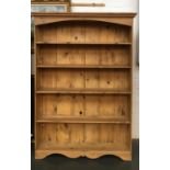 A large pine bookcase, with five shelves, 130cmW