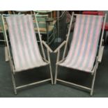 A pair of vintage folding deck chairs