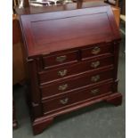 A reproduction hardwood bureau, two short over three graduating drawers, approx. 75cmW