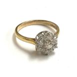 18ct gold ring set with 7 diamonds in a floral cluster gross weight 4.7g, approx 1.2 carats