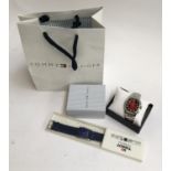 A Tommy Hilfiger watch, mint in box and bag; together with a boxed Tissot watch