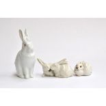 A Herend porcelain figure of a white seated rabbit, 14cm high; together with a Royal Copenhagen