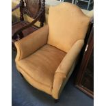 A small 19th century armchair on tapered legs, upholstered in yellow