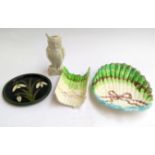 A Belleek white glazed owl; Majollica asparagus platters and a Moorcroft pottery plaque signed by