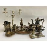 A mixed lot of plated items, to include three piece tea set, pair of candlesticks, three arm