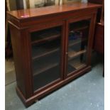 A mahogany and satinwood cross banded glazed bookshelf with three shelves, with key, 120x31x111cmH