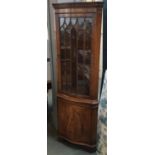 A glazed standing corner cupboard, 180cmH