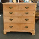 A pine chest of two short over three long drawers, on bracket feet, 103cmW