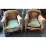 A pair of early 20th century armchairs, on turned oak legs and stretchers