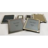 Four silver plated brass photo frames; together with a Waterford Crystal picture frame and stand (6)