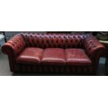 An oxblood vinyl button back chesterfield three seater sofa, approx. 195x84x63cmH