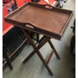 An oak butler's tray, on folding base, 60cmW