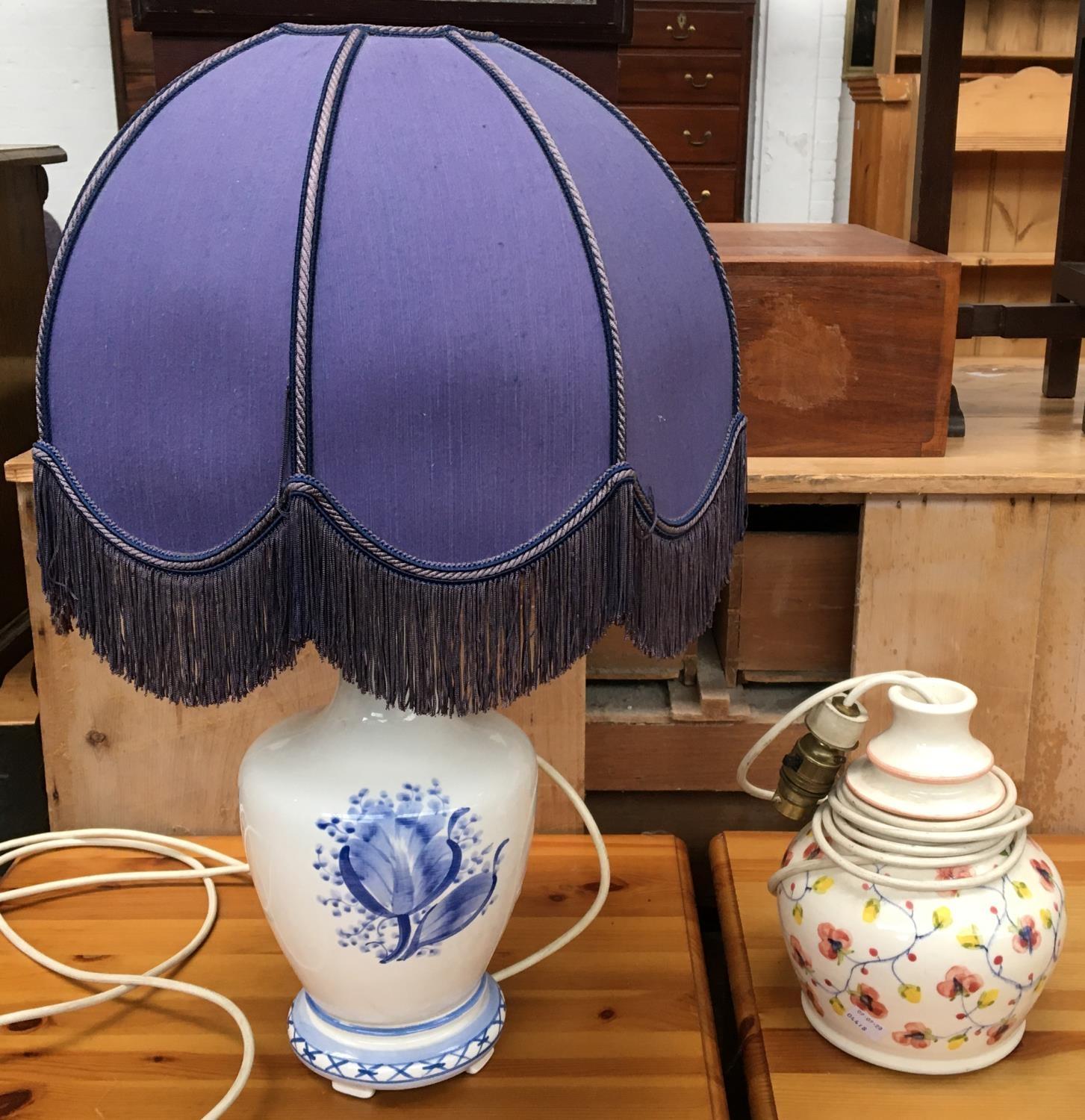 A blue and white ceramic table lamp with shade, together with one other