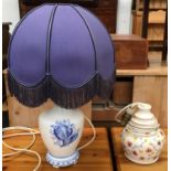 A blue and white ceramic table lamp with shade, together with one other