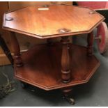 A 19th century mahogany octagonal occasional table with undershelf, on turned feet and brass