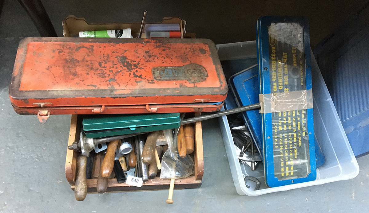 A large lot to include various hand tools, files, toolboxes, die cutting equipment, cased drillbits,