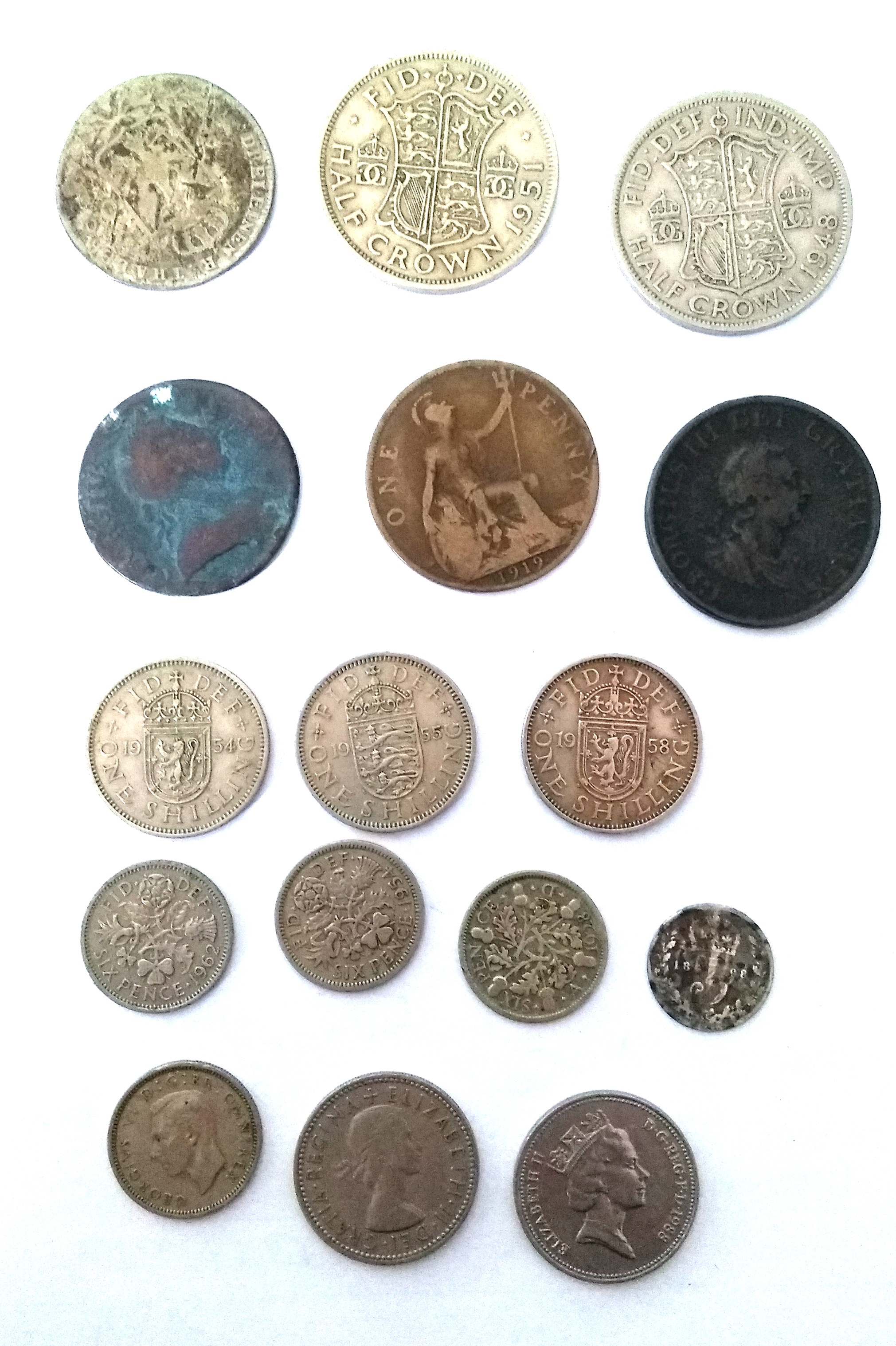 A collection of coins to include a 1898 maundy threepence; 1928 sixpence; 1962 sixpence; 1951 half-