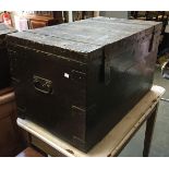 A heavy black painted pine travel chest, with metal bracing and loop handles, 53x53x88cm