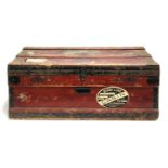 A metal lined travel wood and canvas travel trunk with metal bracings, bears label 'The Marshall