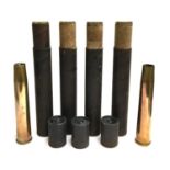 A lot of six 40mm brass shell cases, four in their original cardboard cases
