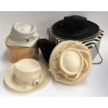 A collection of designer hats to include four Philip Treacy hats in its original box (5)