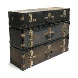 A set of three trunks, each with twin compartments, possibly for transporting guns, each 83cm wide