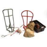 Two saddle racks and one bridle holder, together with a whip, vintage grooming kit, an English