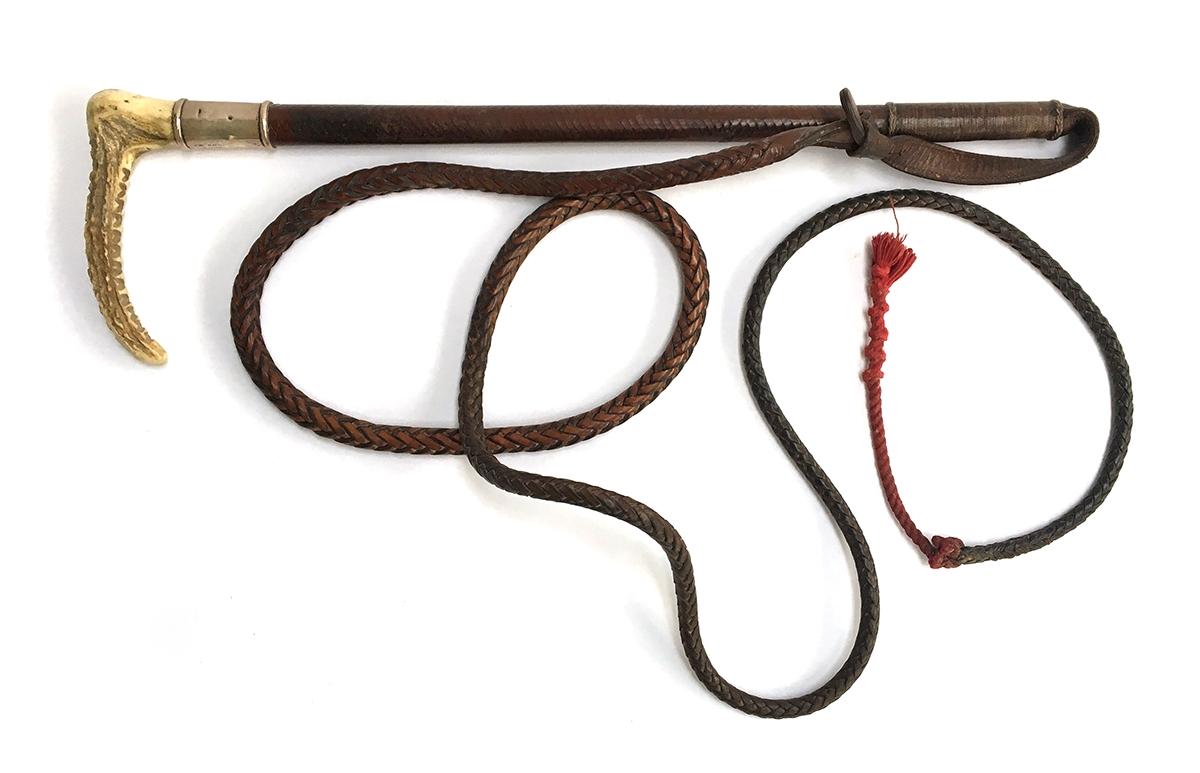 A gent's hunting whip, 48cmL, with whale bone shaft bound in leather, silver collar hallmarked for