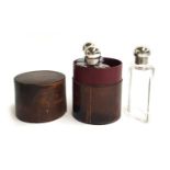 A leather cylinder cased set of three glass spirit flasks, each with silver top by S Blanckensee &