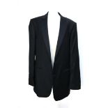 A gent's black tie wool dinner jacker and trousers, single breasted with two buttons, by Gieves &