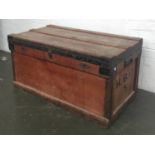 A metal lined travel wood and canvas travel trunk with metal bracings, bears label 'The Marshall