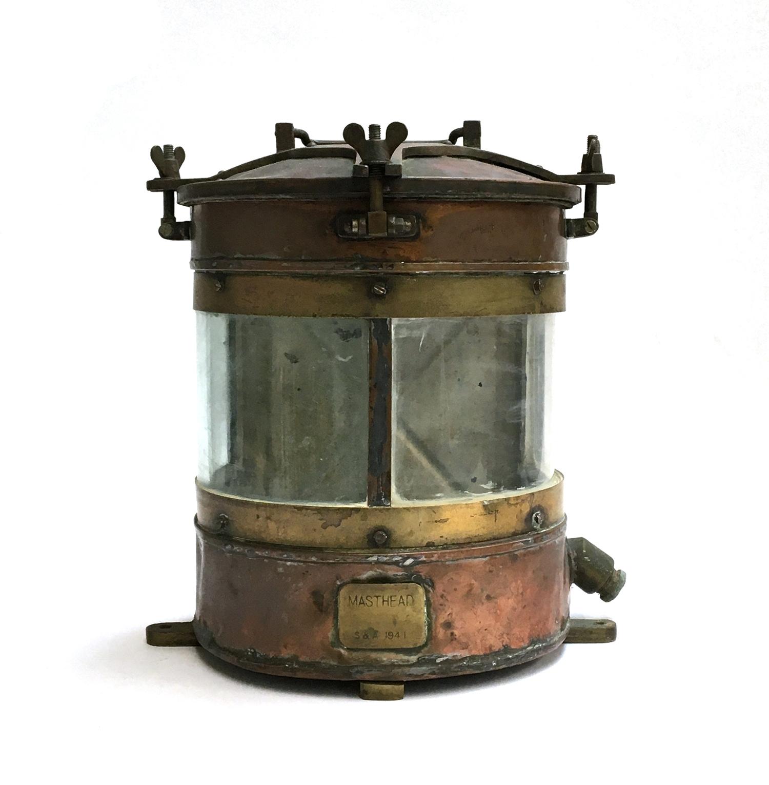 A large copper ship's masthead lantern, brass plaque inscribed 'Masthead, S&A 1941, 35cm high