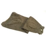 Two pairs of tweed shooting breeks with button flies, together with one pair of grey flannel shorts