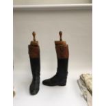 A pair of gent's black leather hunting boots with mahogany tops, patch repairs, approx. size 9.5,