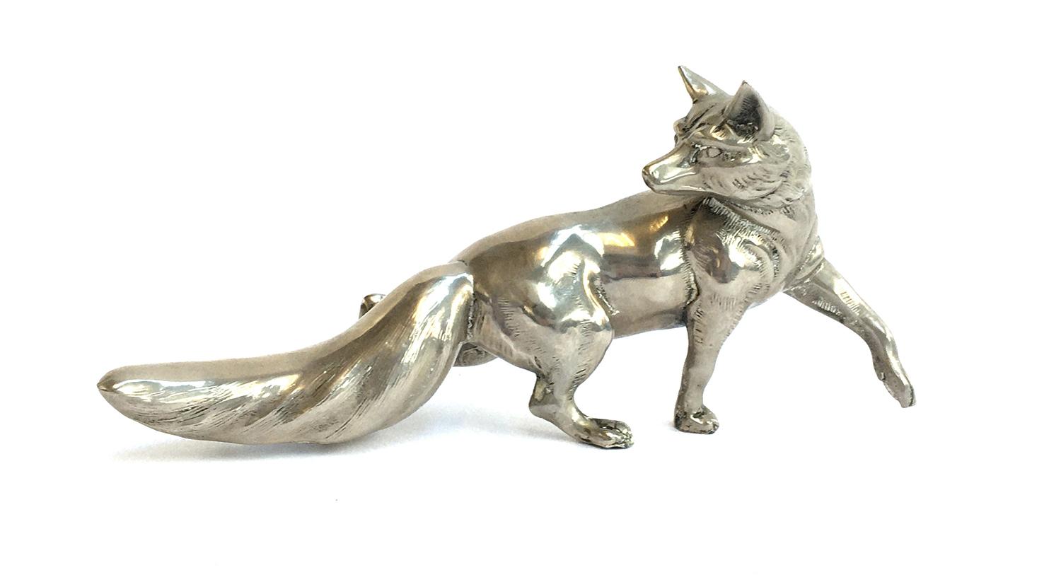 A Continental white metal fox figurine, 23cmL