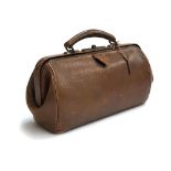 A brown leather doctor's bag with canvas lining, two internal pockets, and key, 35cm long