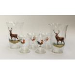 Two glass tumblers hand painted with red deer stags; and four shot glasses hand painted with cocks