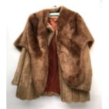 A faux fur jacket together with a faux fur stole