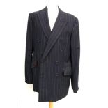 A navy double breasted pinstripe suit by A.T. McGurrell, London W1 (1995), with wine coloured lining