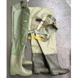 A pair of size 10 chest waders, studs to sole; together with a pair of size 11 thigh waders