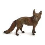 A cold painted figure of a fox, approximately 10cm long