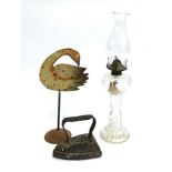 A Victorian painted tin goose, together with a flatiron, and a glass oil lamp