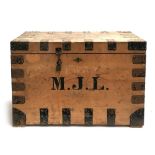 A pine travel chest with metal bracing and loop handles, bears label 'M. Cleghorn, Edinburgh,