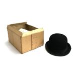 A Thomas & Stone, London, black bowler hat, size 7 1/4, in box without lid