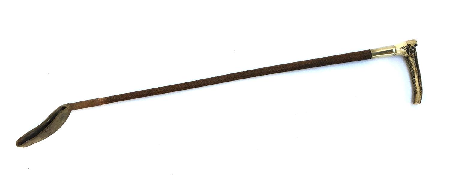 A gent's hunting whip with whalebone and antler handle, metal collar, 73cm long