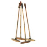 Four bamboo polo sticks from J Salter & Son, Aldershot
